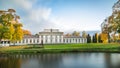 TaujÃânai manor amazing autumn nature. Classicist palace with a portico of 6 columns.